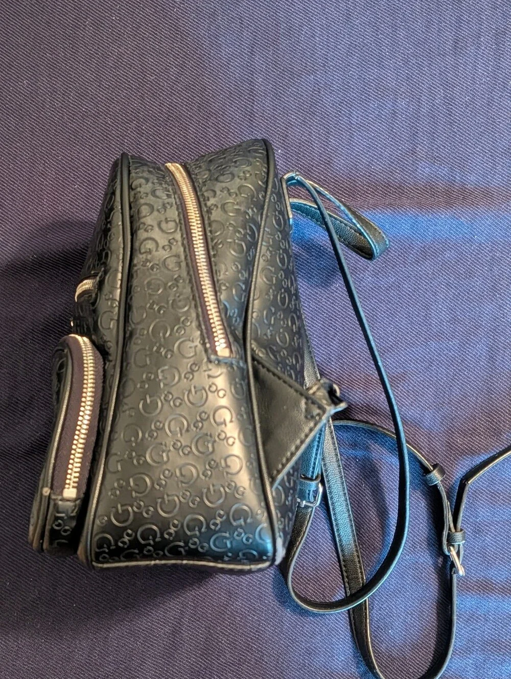 GUESS Black Embossed Logo Mini Backpack with Gold Accent